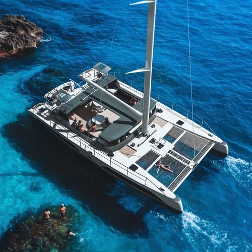 Barca a vela daysailer - SB650 - SEABUS - CATAMARANI MULTIRUOLO - catamarano / in fibra di vetro / con doppio timone a ruota